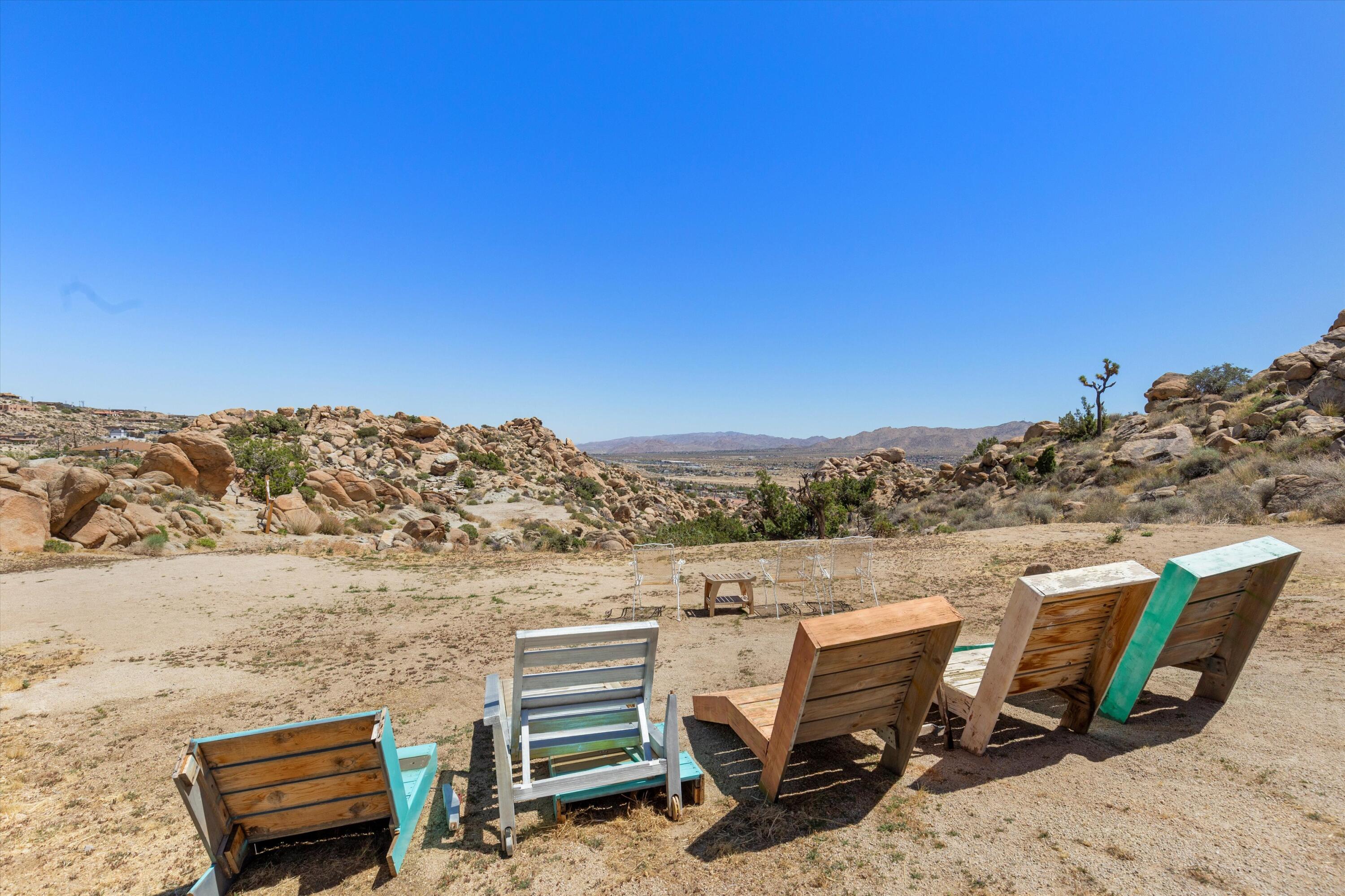 57113 Farrelo Road Yucca Valley, CA 92284 - Photo 19 of 50 a view of a terrace with a table and chairs