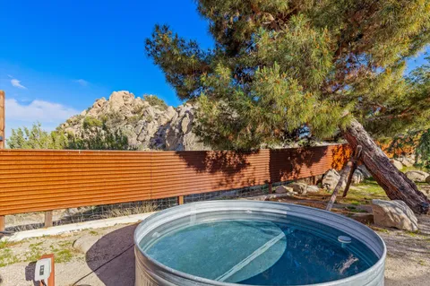 a view of a backyard with sitting area