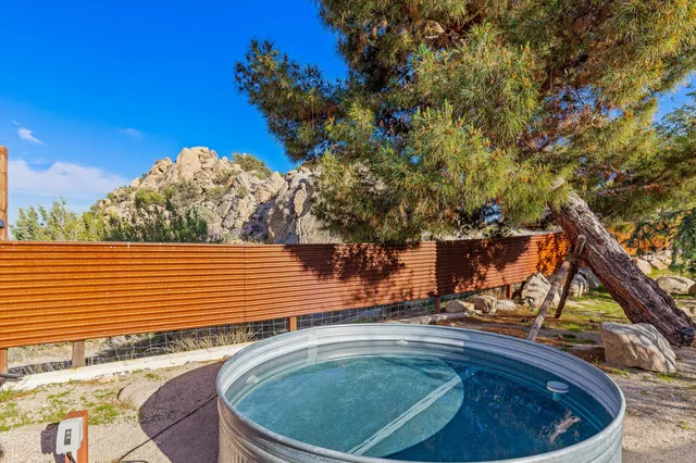 a view of a backyard with sitting area