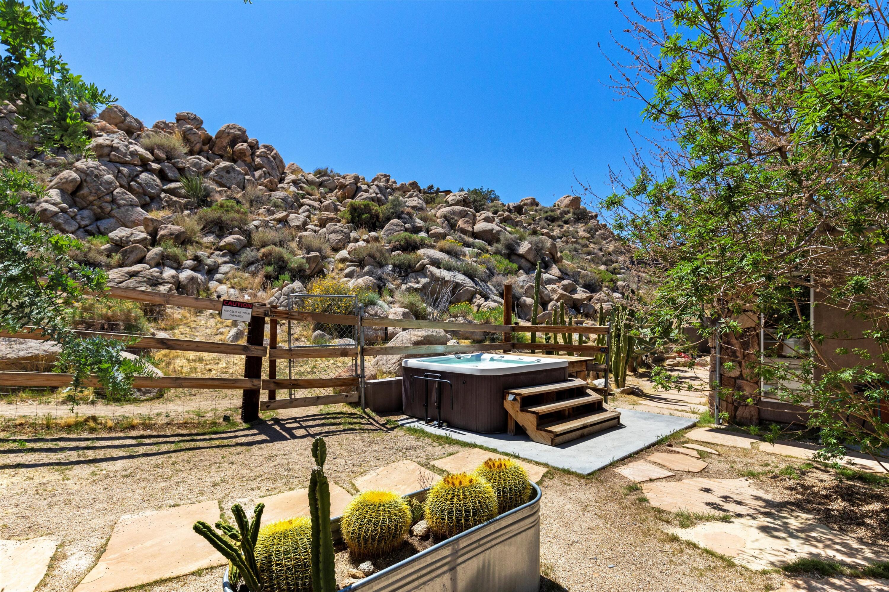 57113 Farrelo Road Yucca Valley, CA 92284 - Photo 33 of 50 a view of a backyard with sitting area