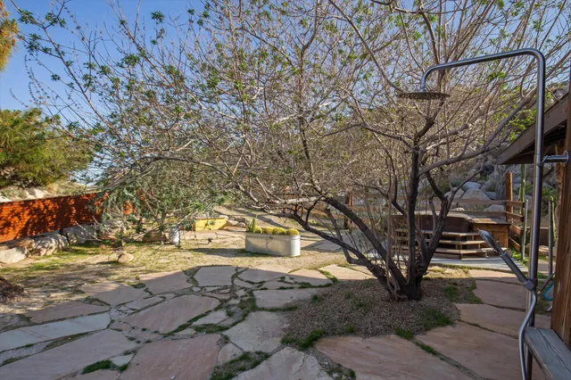 a swimming pool with outdoor seating