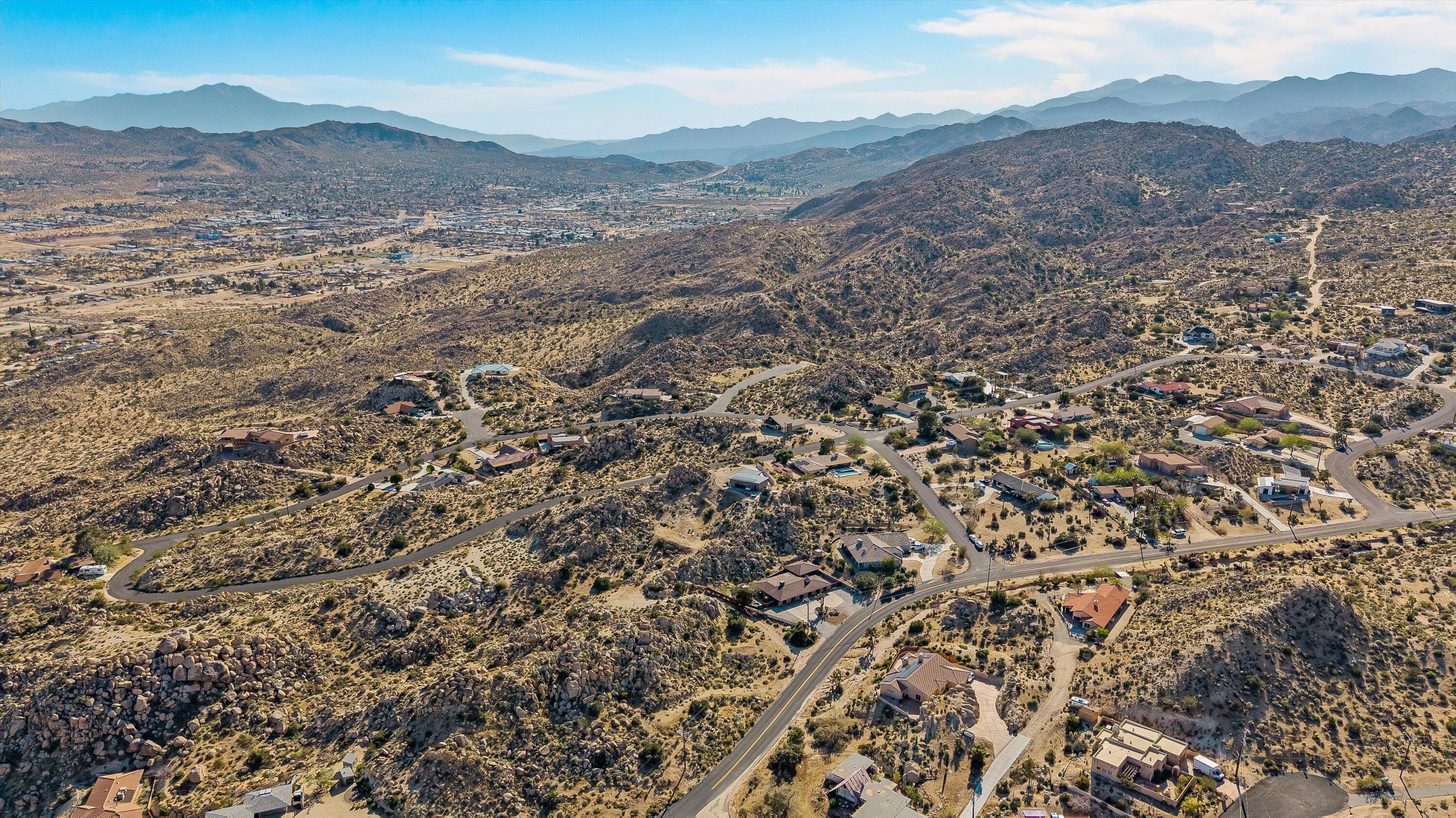 57113 Farrelo Road Yucca Valley, CA 92284 - Photo 49 of 50 a view of a mountain range with lush green forest