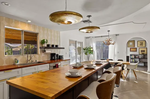 a room with lots of table and chairs