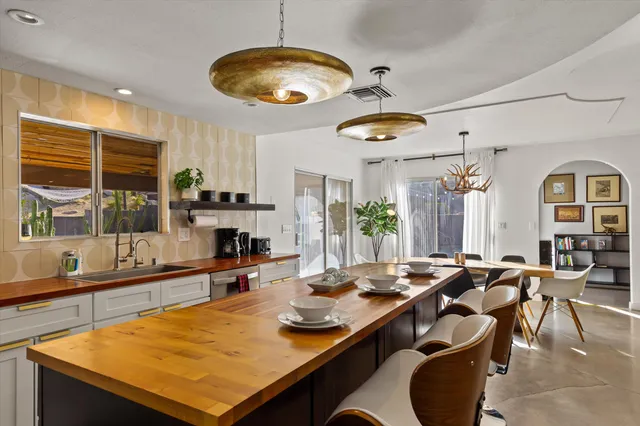 a room with lots of table and chairs