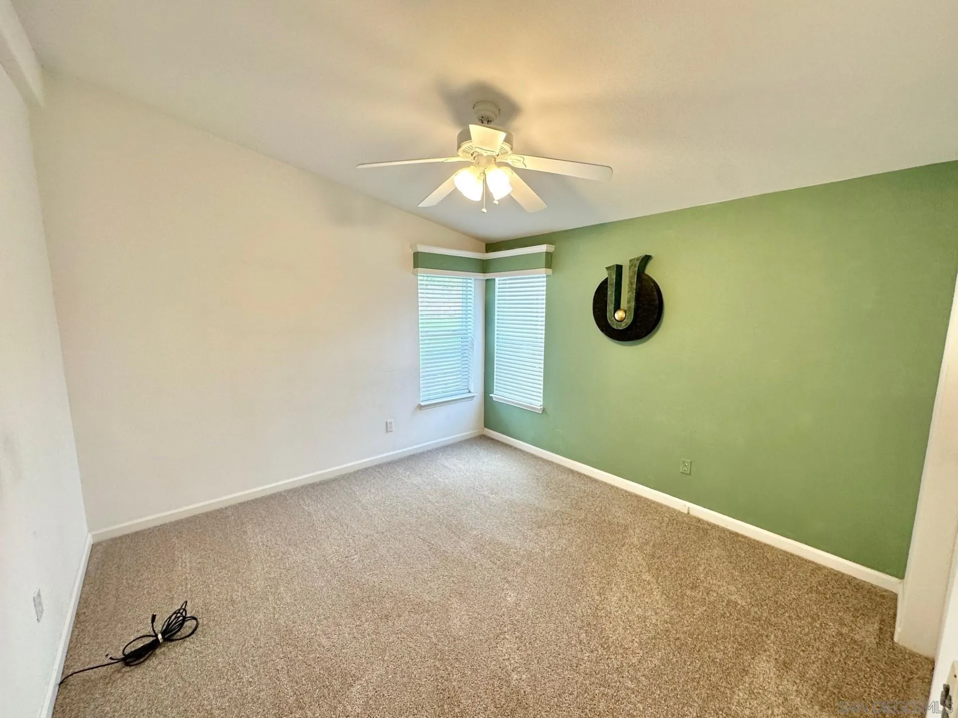 13307 Alpine Drive, Unit 2 Poway, CA 92064 - Photo 4 of 13 an empty room with windows and fan