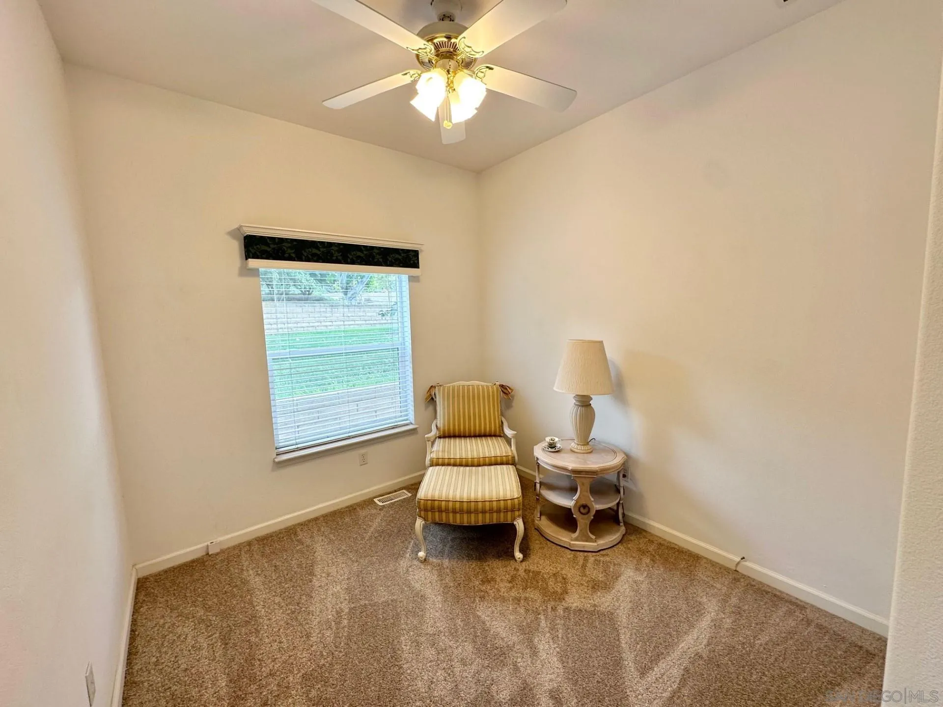 13307 Alpine Drive, Unit 2 Poway, CA 92064 - Photo 5 of 13 a room with a window and ceiling fan