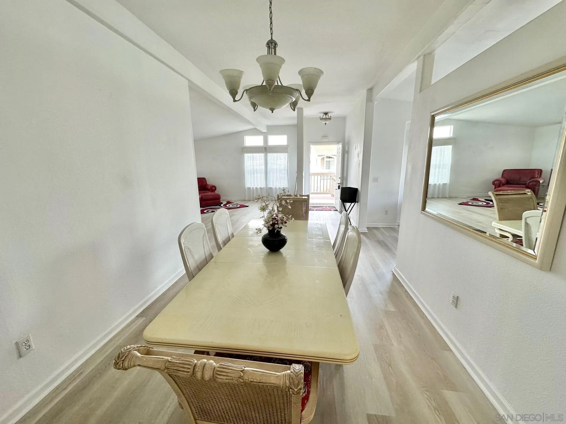 13307 Alpine Drive, Unit 2 Poway, CA 92064 - Photo 8 of 13 a view of a dining room with furniture and a chandelier