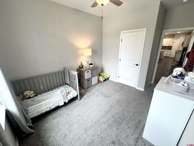 a bed room with a bed and a couch