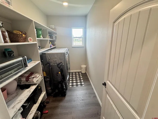 a view of an entryway with wooden floor