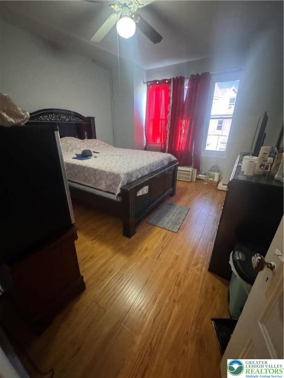 1104 South 7th Street Allentown, PA 18103 - Photo 14 of 27 a bed room with a bed window and dresser