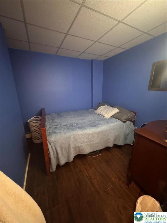 1104 South 7th Street Allentown, PA 18103 - Photo 15 of 27 a bedroom with a bed and wooden floor