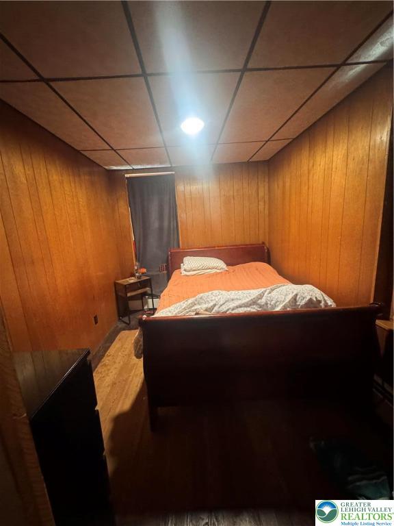 1104 South 7th Street Allentown, PA 18103 - Photo 16 of 27 a bed sitting in a spacious bedroom next to a window