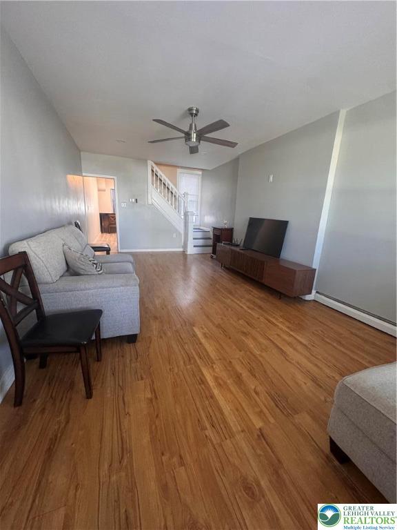 1104 South 7th Street Allentown, PA 18103 - Photo 4 of 27 a living room with furniture and a wooden floor