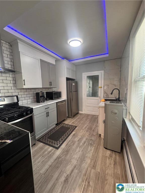 1104 South 7th Street Allentown, PA 18103 - Photo 7 of 27 a kitchen with stove cabinets and refrigerator