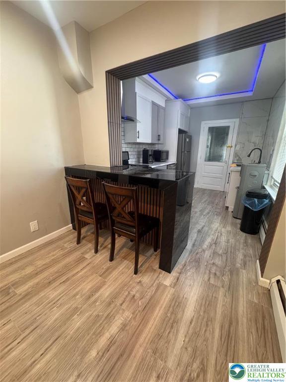 1104 South 7th Street Allentown, PA 18103 - Photo 9 of 27 a dining room with furniture and wooden floor