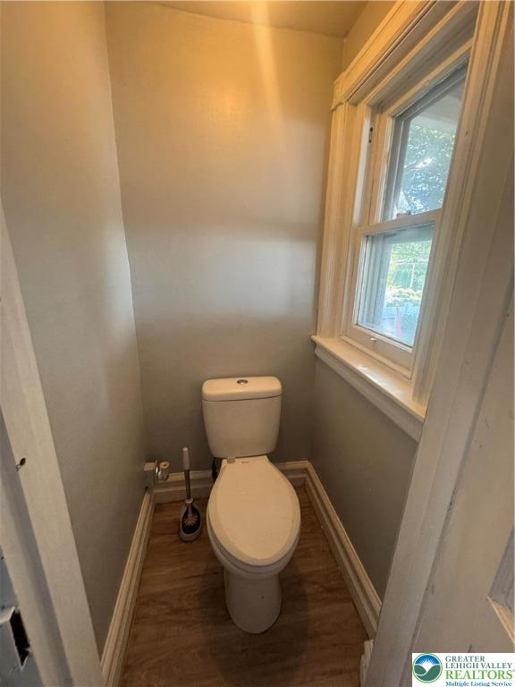 1104 South 7th Street Allentown, PA 18103 - Photo 10 of 27 a white toilet sitting in a bathroom next to a window