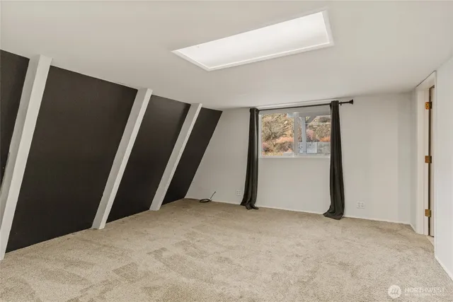 a bathroom with a sink a toilet and shower curtain