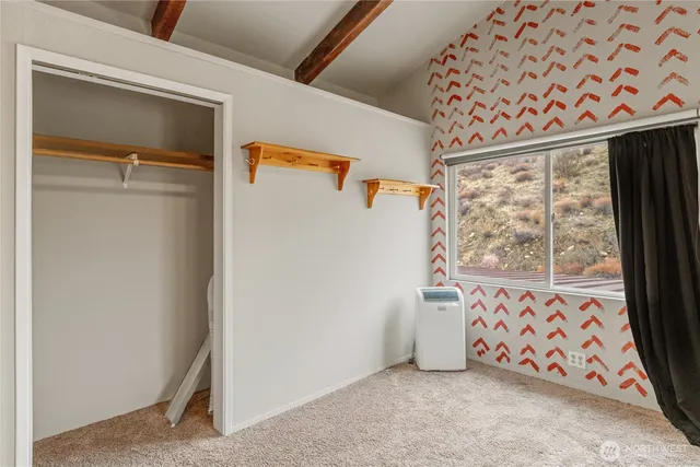 a view of livingroom with furniture and a window