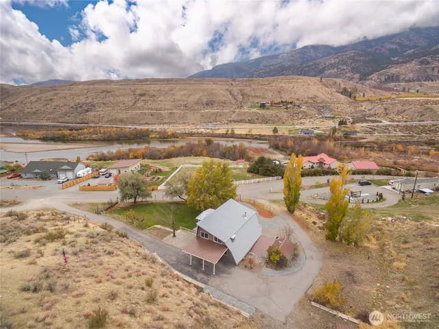 an aerial view of a house with a ocean view