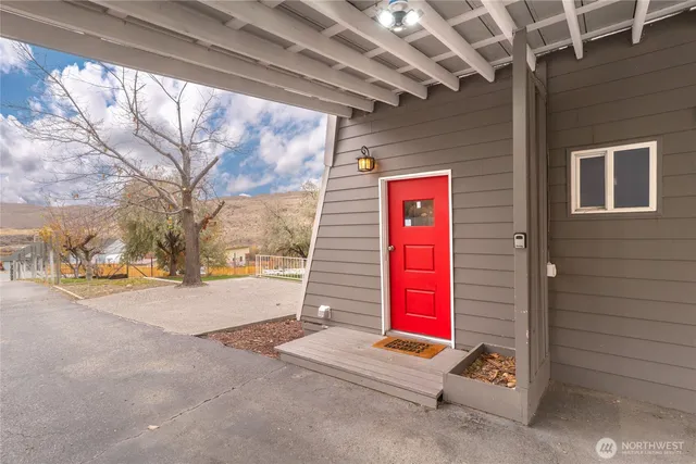 a view of an entryway with wooden floor