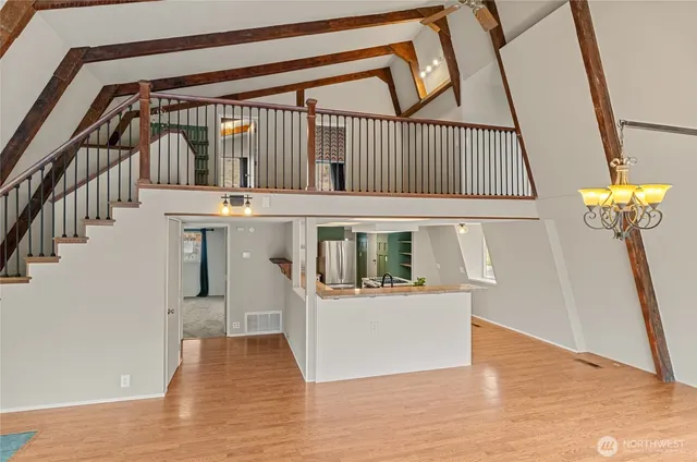 a view of an entryway with wooden floor