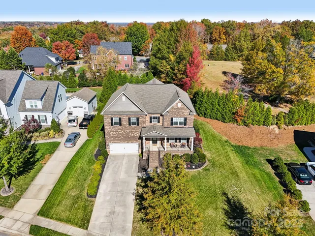an aerial view of a house with a garden