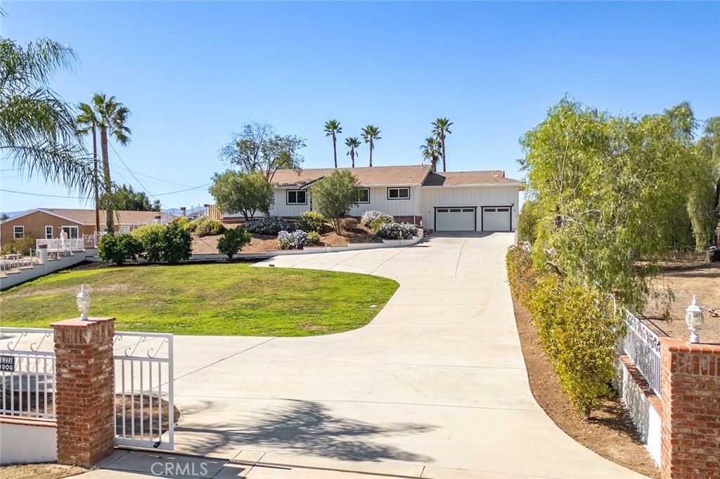 27875 Goetz Road Menifee, CA 92587 - Photo 1 of 74 a view of a swimming pool with outdoor seating and plants