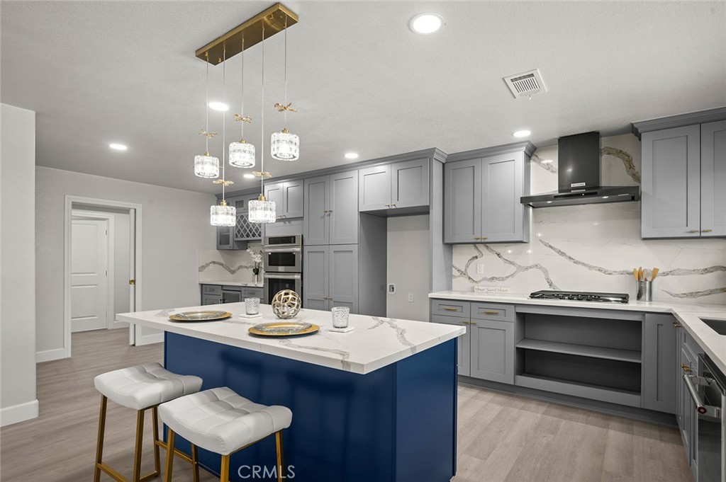 27875 Goetz Road Menifee, CA 92587 - Photo 11 of 74 a kitchen with a sink appliances and cabinets