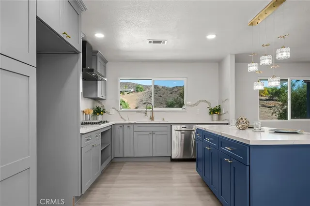 a kitchen with a stove and cabinets