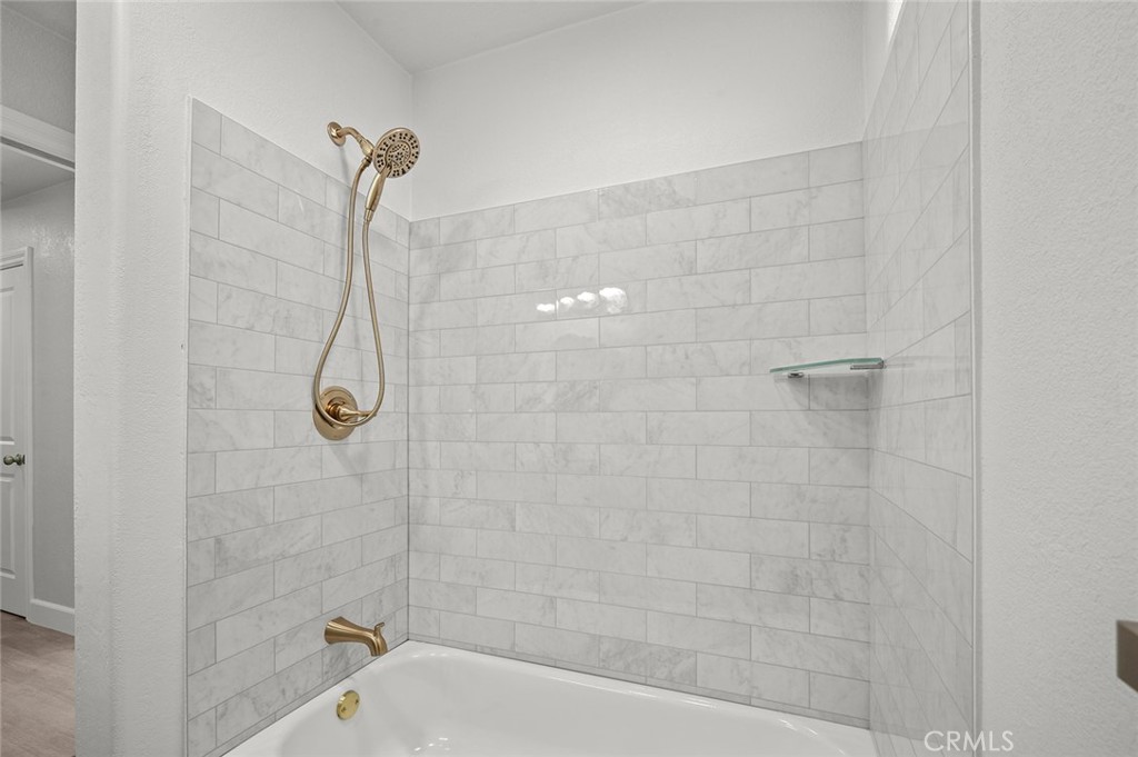 27875 Goetz Road Menifee, CA 92587 - Photo 28 of 74 a bathroom with a shower