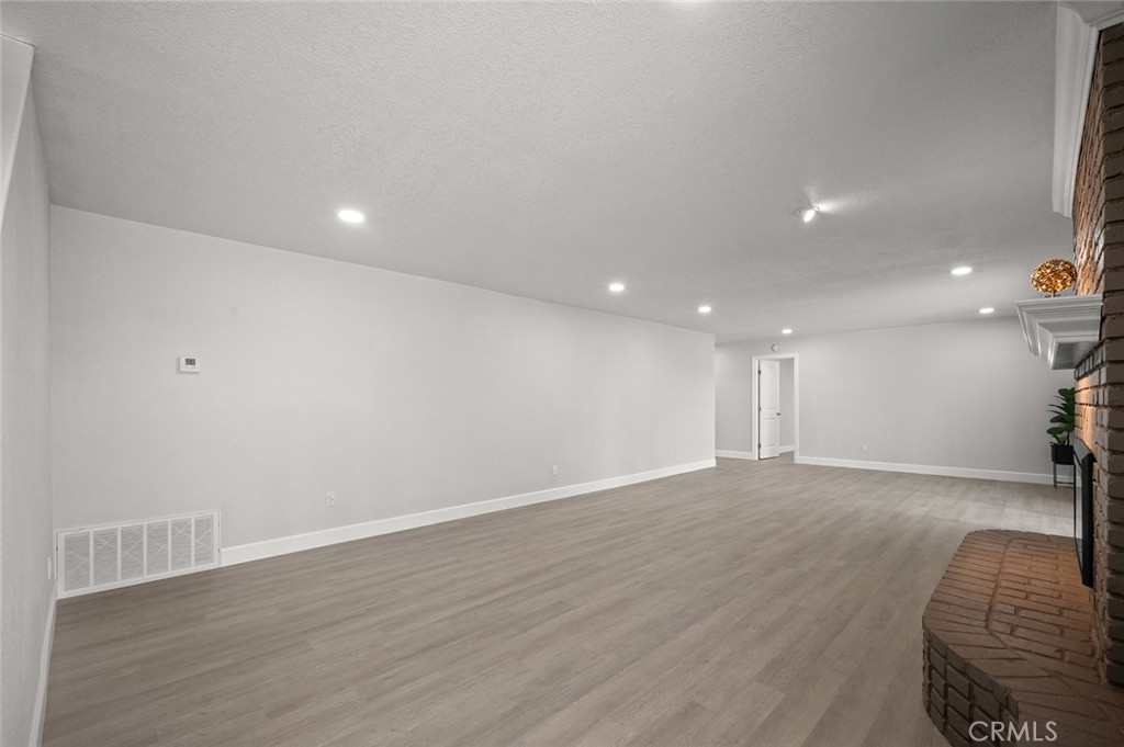 27875 Goetz Road Menifee, CA 92587 - Photo 37 of 74 a view of an empty room with wooden floor