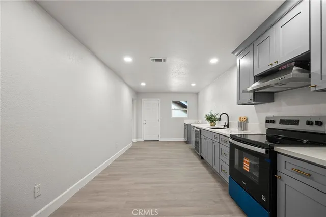 a view of a house with palm trees