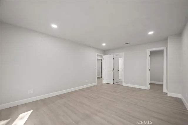 a view of a street with palm trees