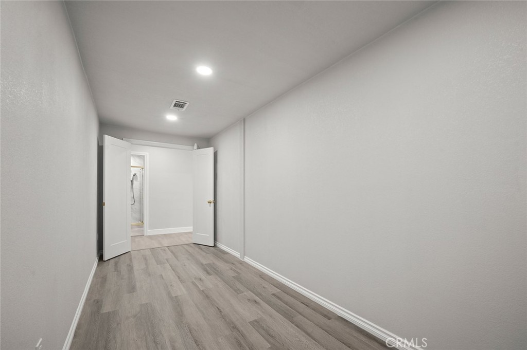 27875 Goetz Road Menifee, CA 92587 - Photo 50 of 74 a view of hallway with closet and wooden floor