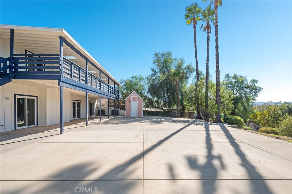 27875 Goetz Road Menifee, CA 92587 - Photo 61 of 74 a view of a house with palm trees