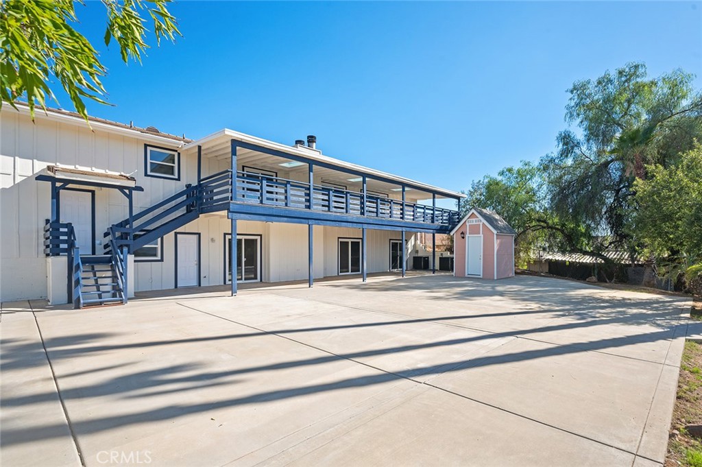 27875 Goetz Road Menifee, CA 92587 - Photo 62 of 74 a front view of a house with a garden