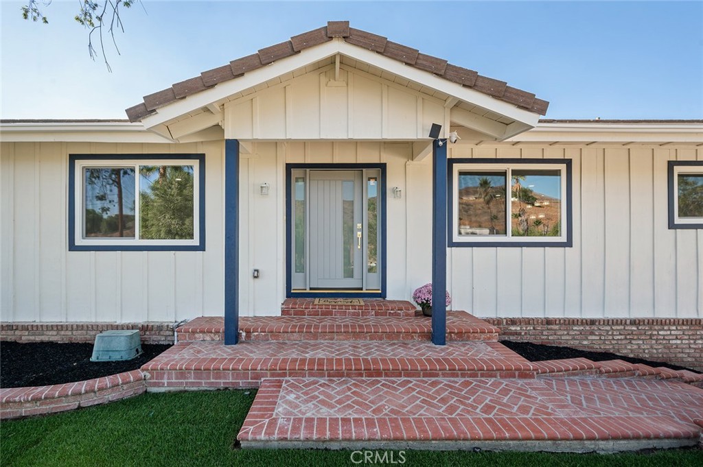 27875 Goetz Road Menifee, CA 92587 - Photo 7 of 74 a front view of a house with garden