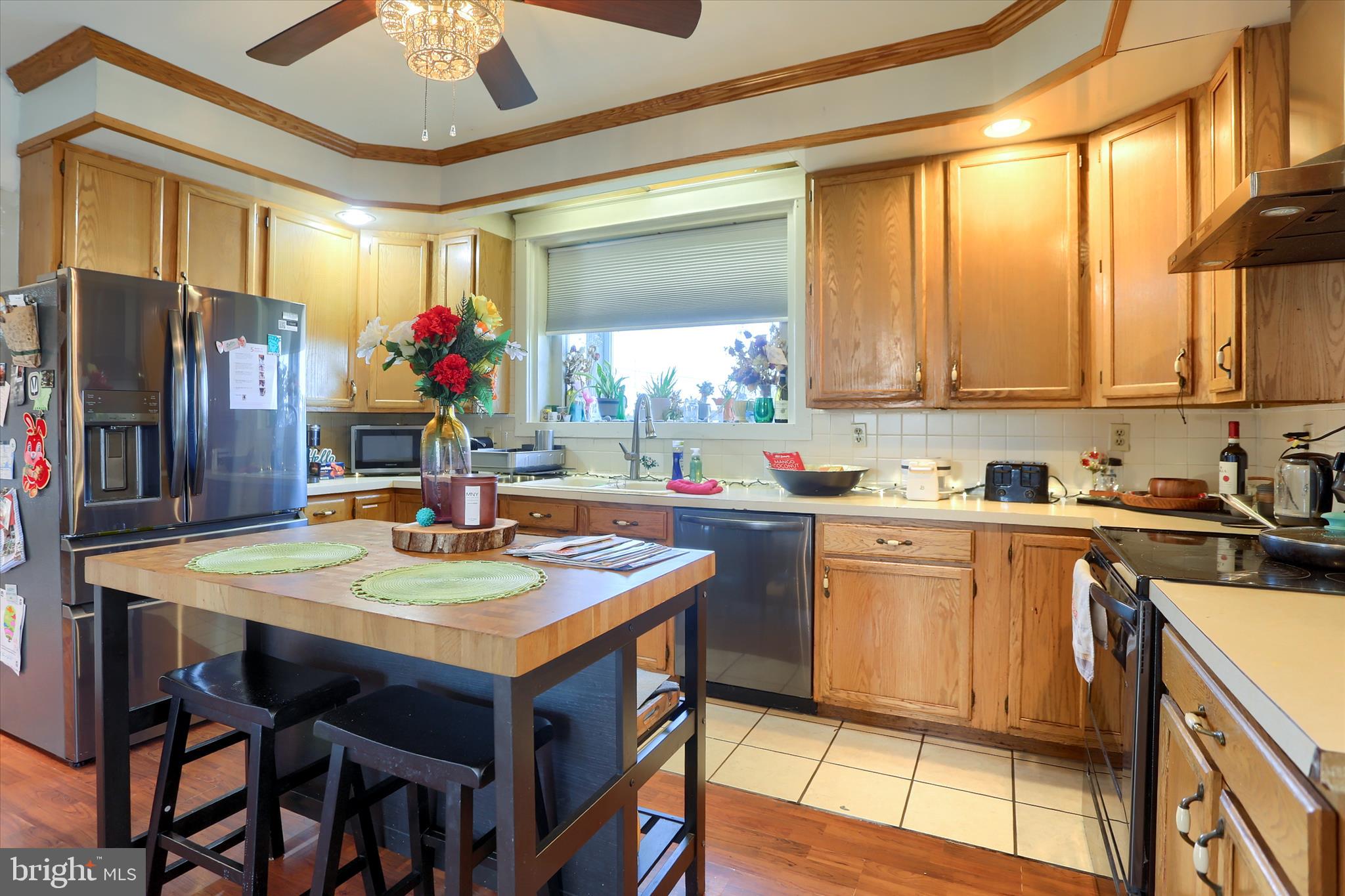 112 Lewisberry Road New Cumberland, PA 17070 - Photo 17 of 56 a kitchen with stainless steel appliances granite countertop table chairs sink and cabinets