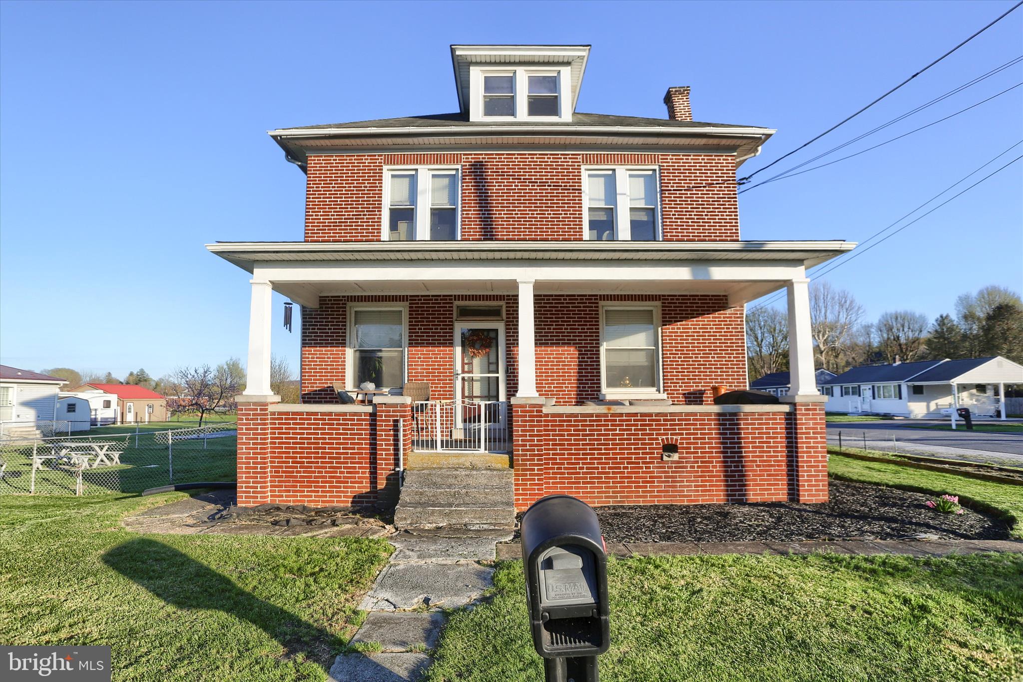 112 Lewisberry Road New Cumberland, PA 17070 - Photo 2 of 56 a front view of a house with garden