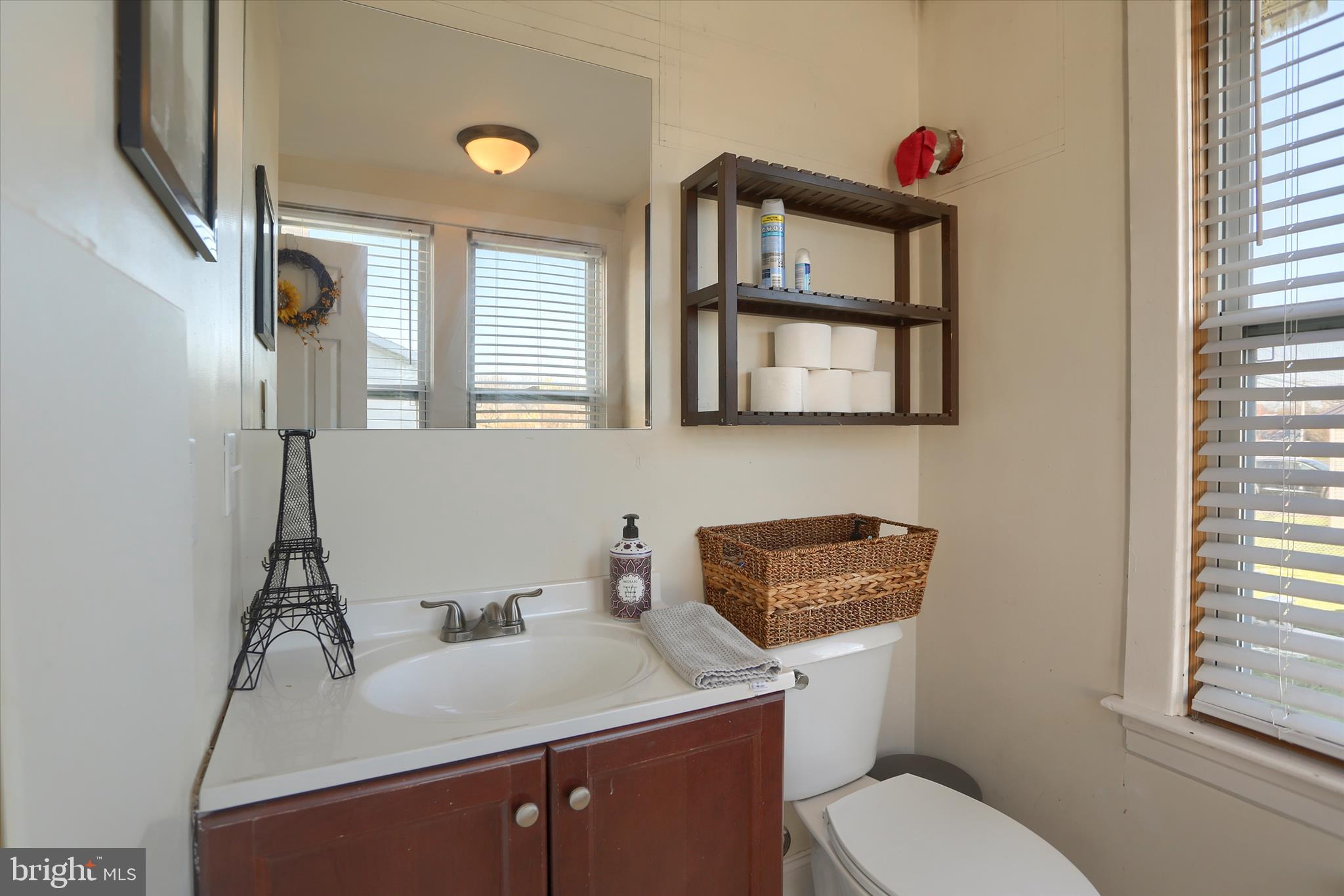 112 Lewisberry Road New Cumberland, PA 17070 - Photo 22 of 56 a bathroom with a toilet a sink and a window