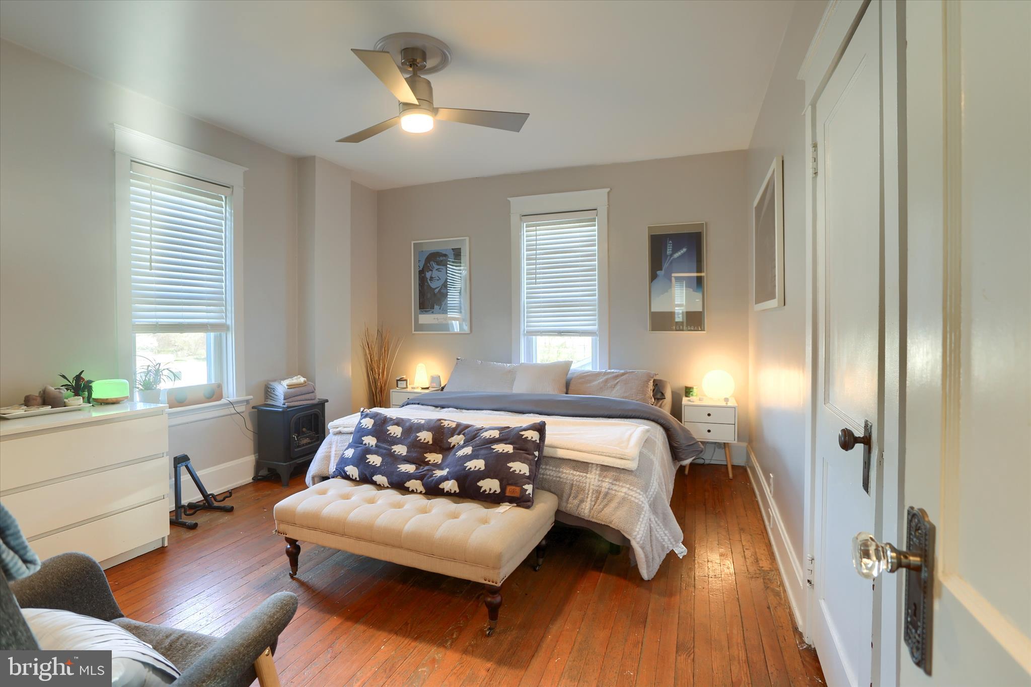 112 Lewisberry Road New Cumberland, PA 17070 - Photo 23 of 56 a bedroom with a bed and wooden floor