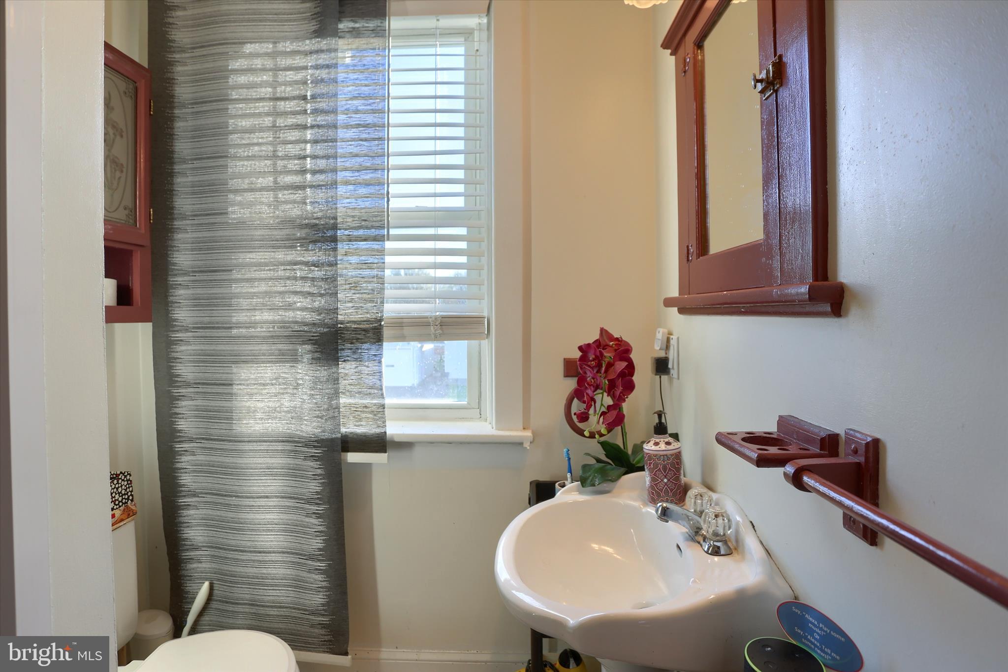 112 Lewisberry Road New Cumberland, PA 17070 - Photo 30 of 56 a bathroom with a sink mirror and toilet