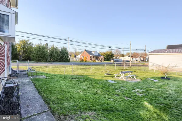 a view of a swimming pool with a yard
