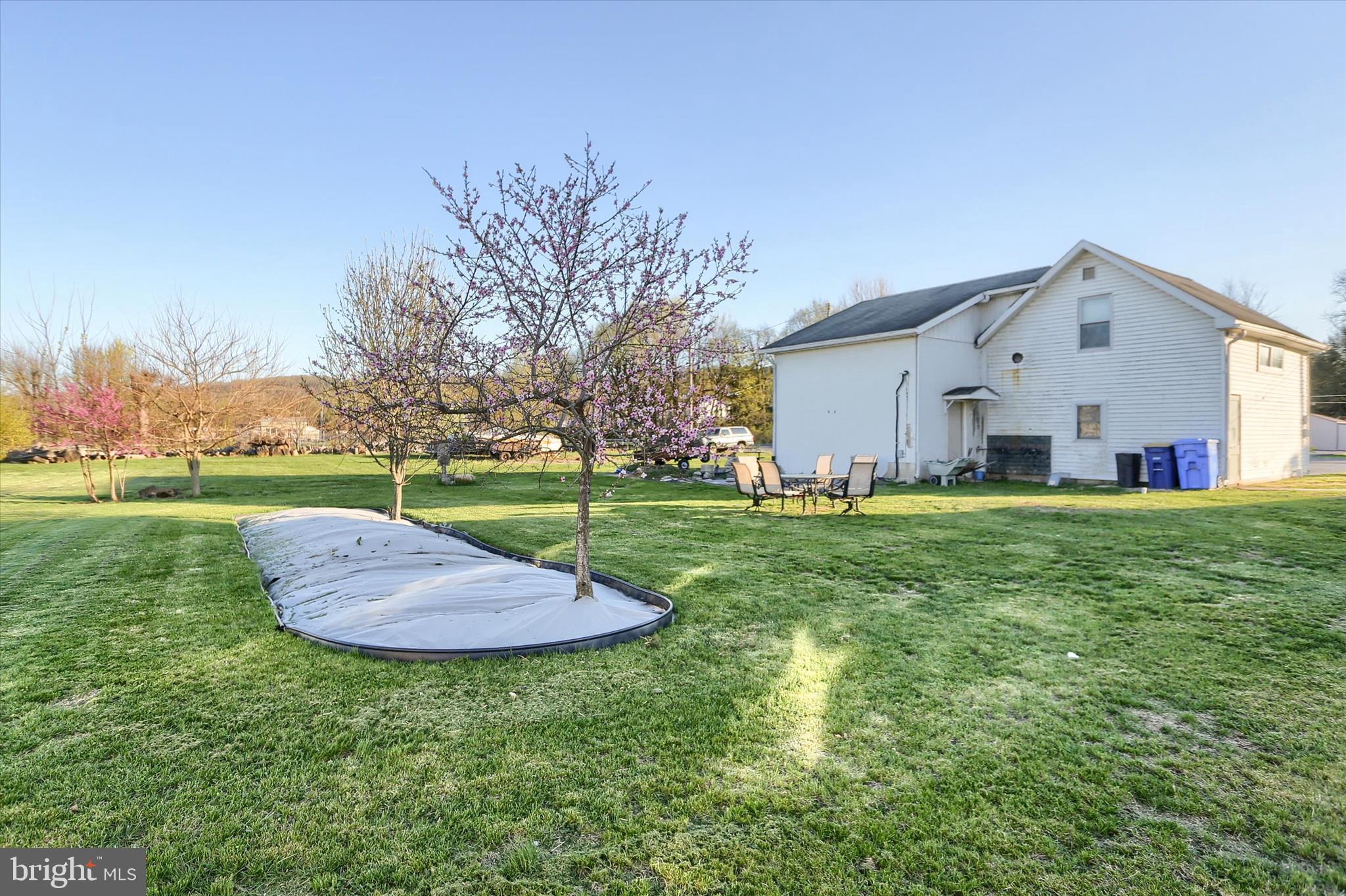 112 Lewisberry Road New Cumberland, PA 17070 - Photo 37 of 56 a view of a house with a yard and sitting area