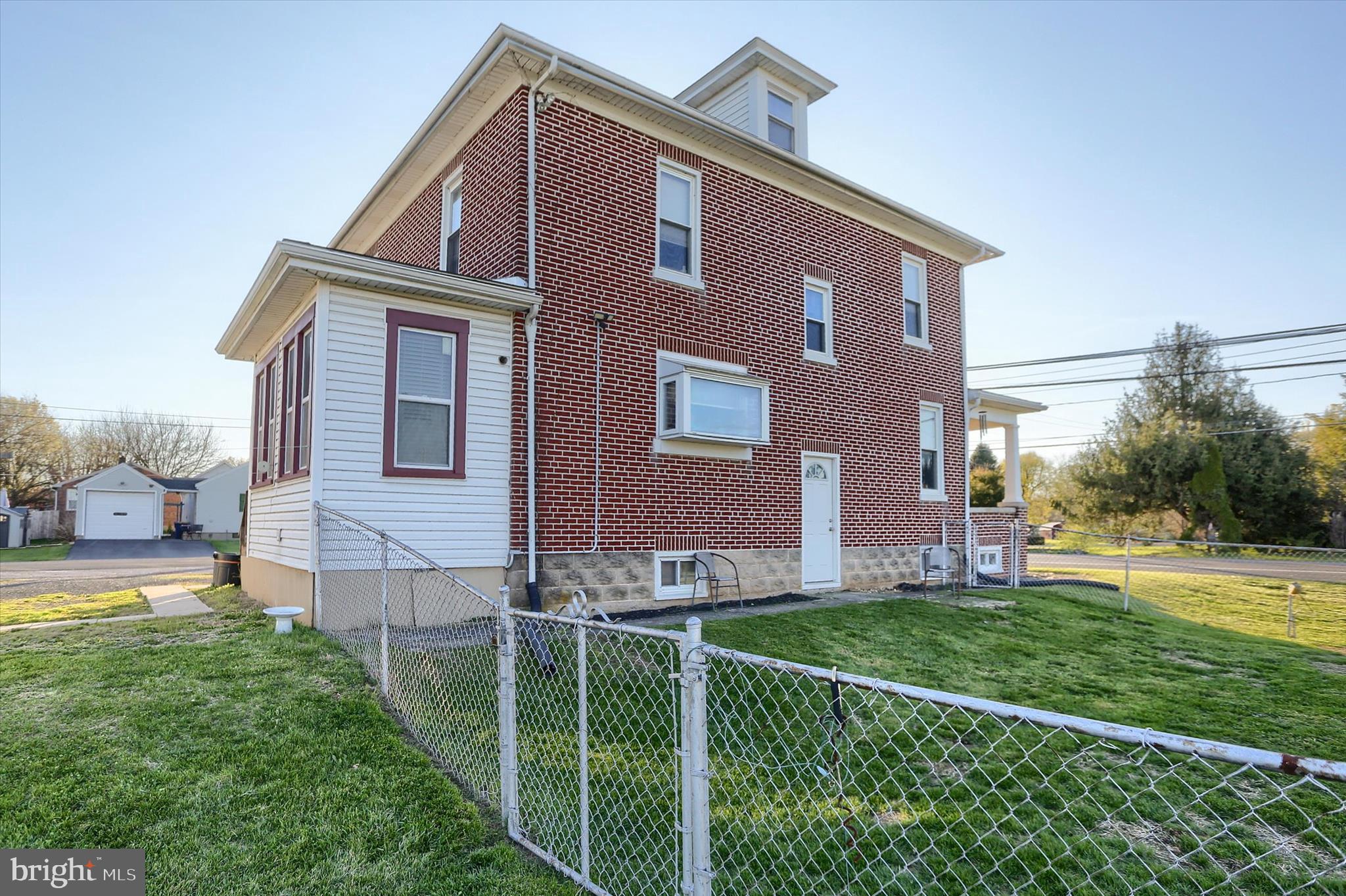 112 Lewisberry Road New Cumberland, PA 17070 - Photo 38 of 56 a front view of a house with a yard