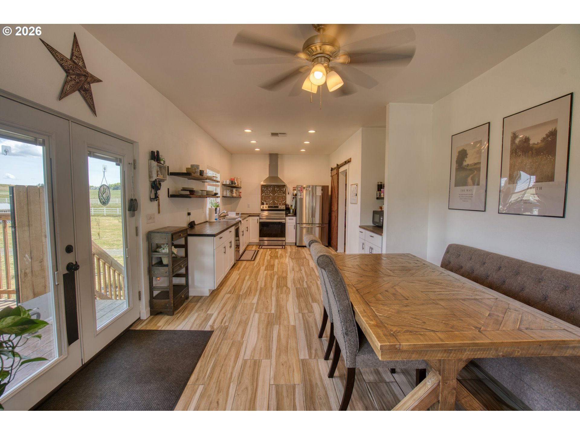 19 Inverness Road Goldendale, WA 98620 - Photo 18 of 48 a living room with stainless steel appliances kitchen island a table chairs and a kitchen view