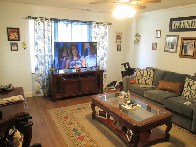 a living room with furniture and a window