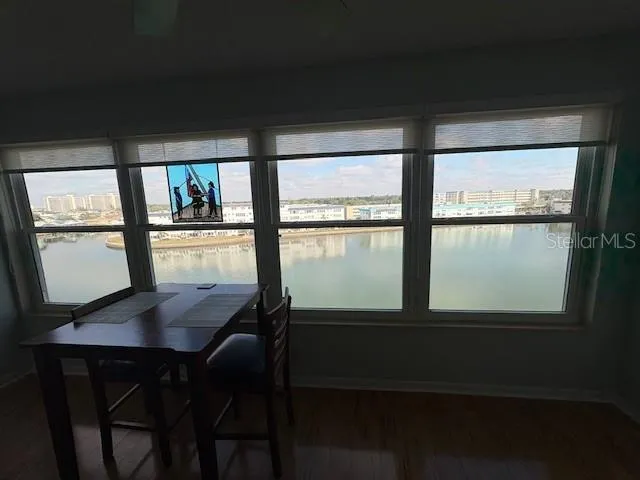 a view of a dining room with furniture and window