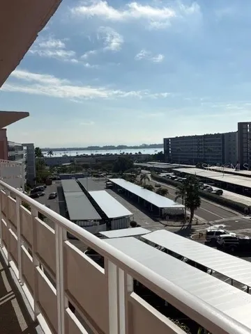 a view of a roof deck with wooden fence