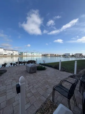 a view of a chairs and table in the patio